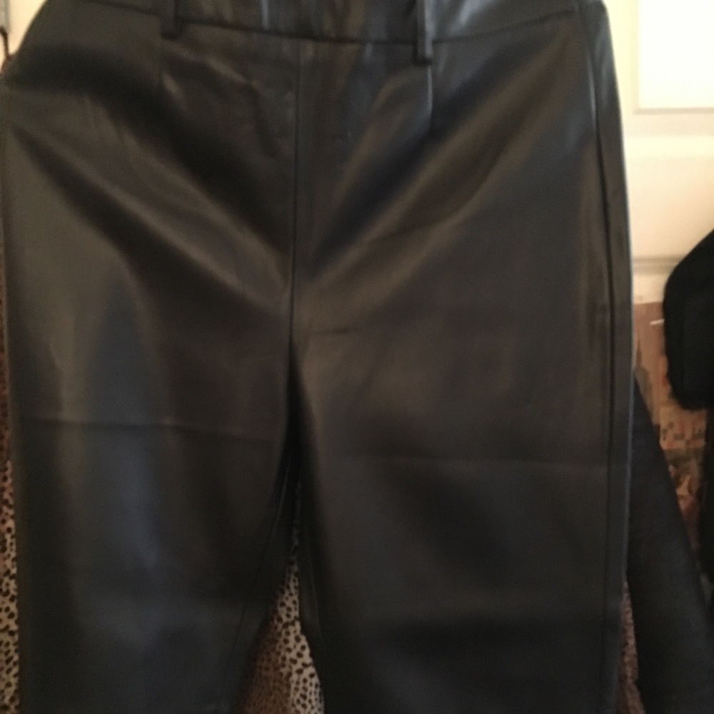 Black Zara leather pants with tags .  Size L.  Zippers on side of pant legs!